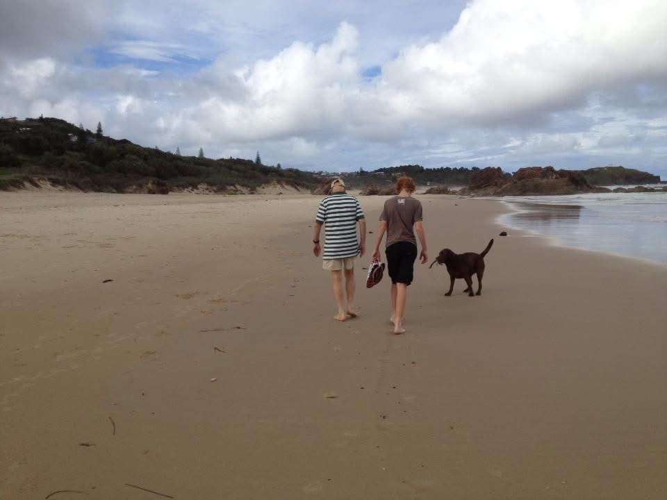 Parent and child walking together outdoors